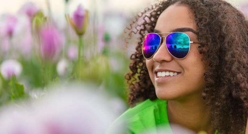 girl in sunglasses with flowers